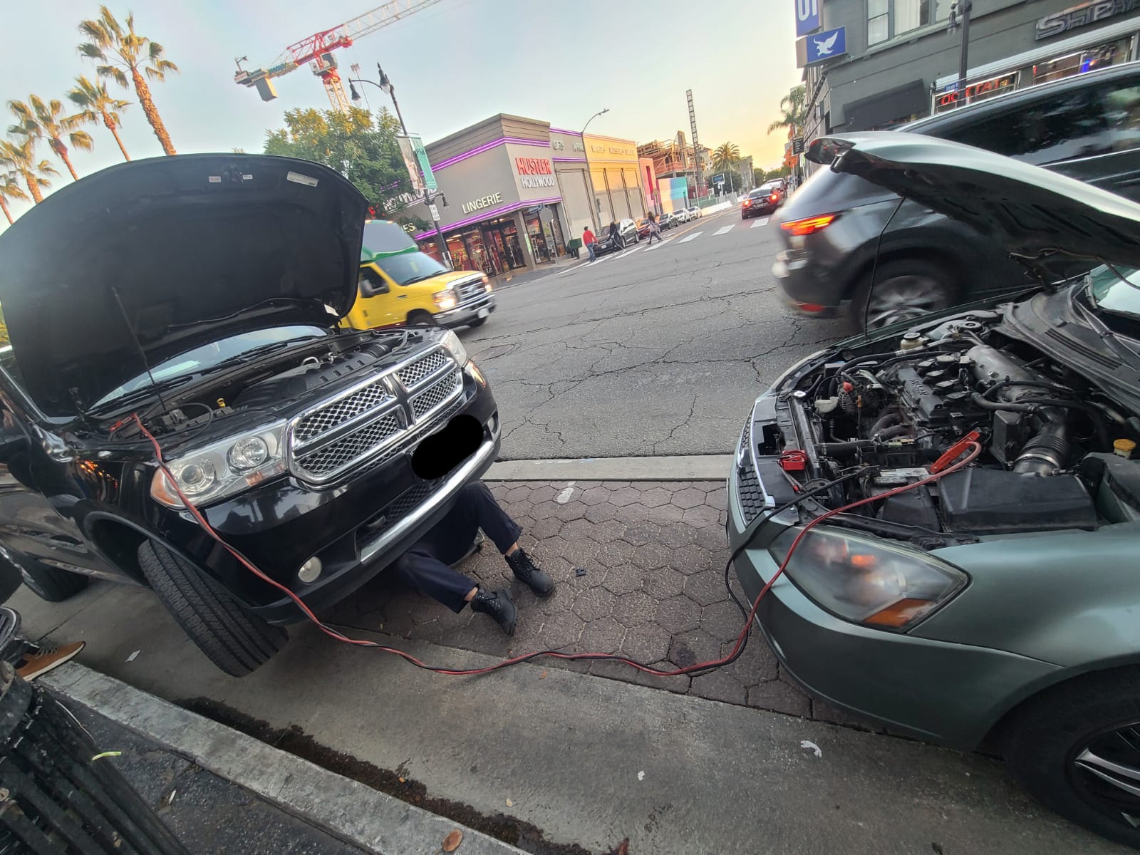 Two vehicles receiving on-site repairs